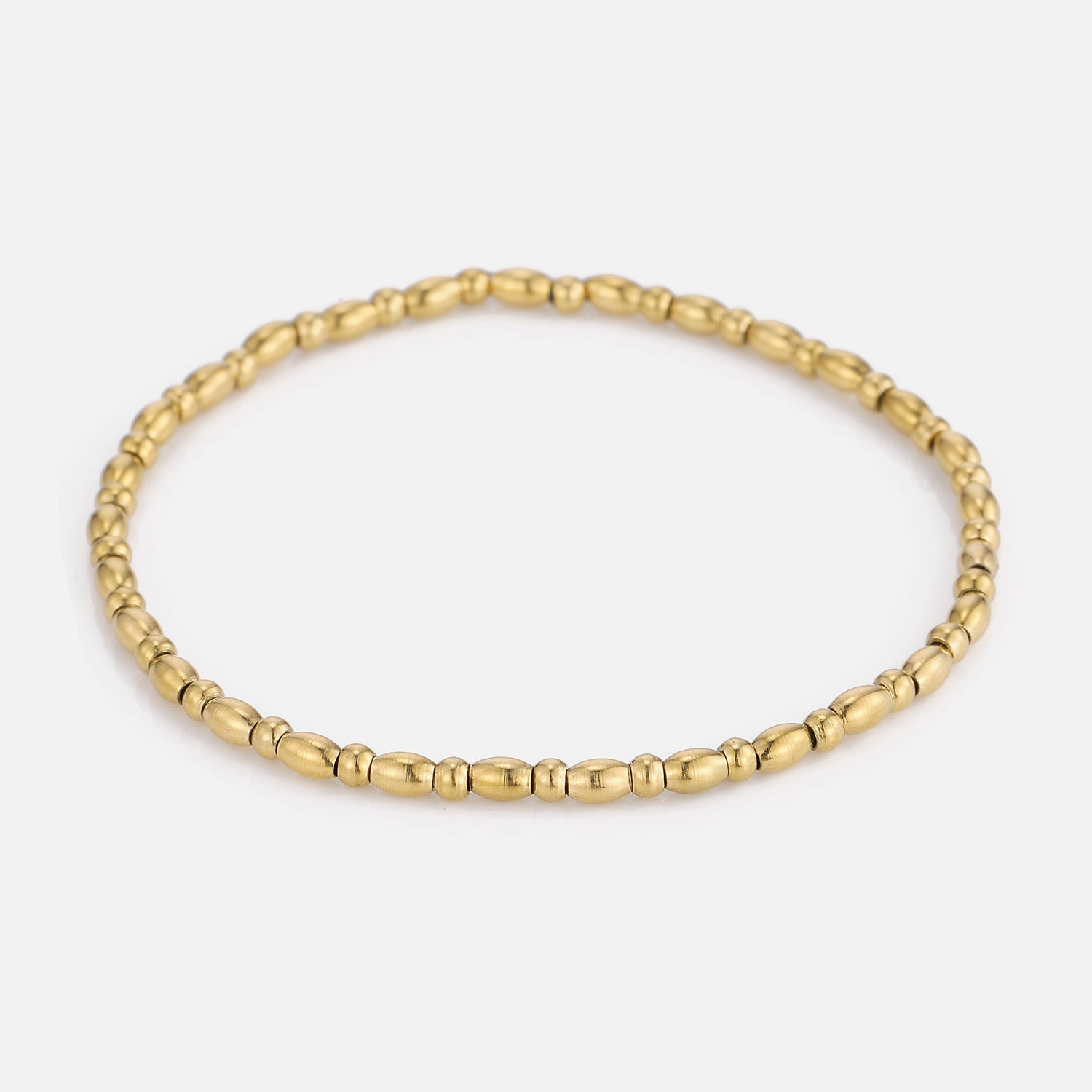 Armband kleine bolletjes stretch goud - Desieradenconcurrent.nl