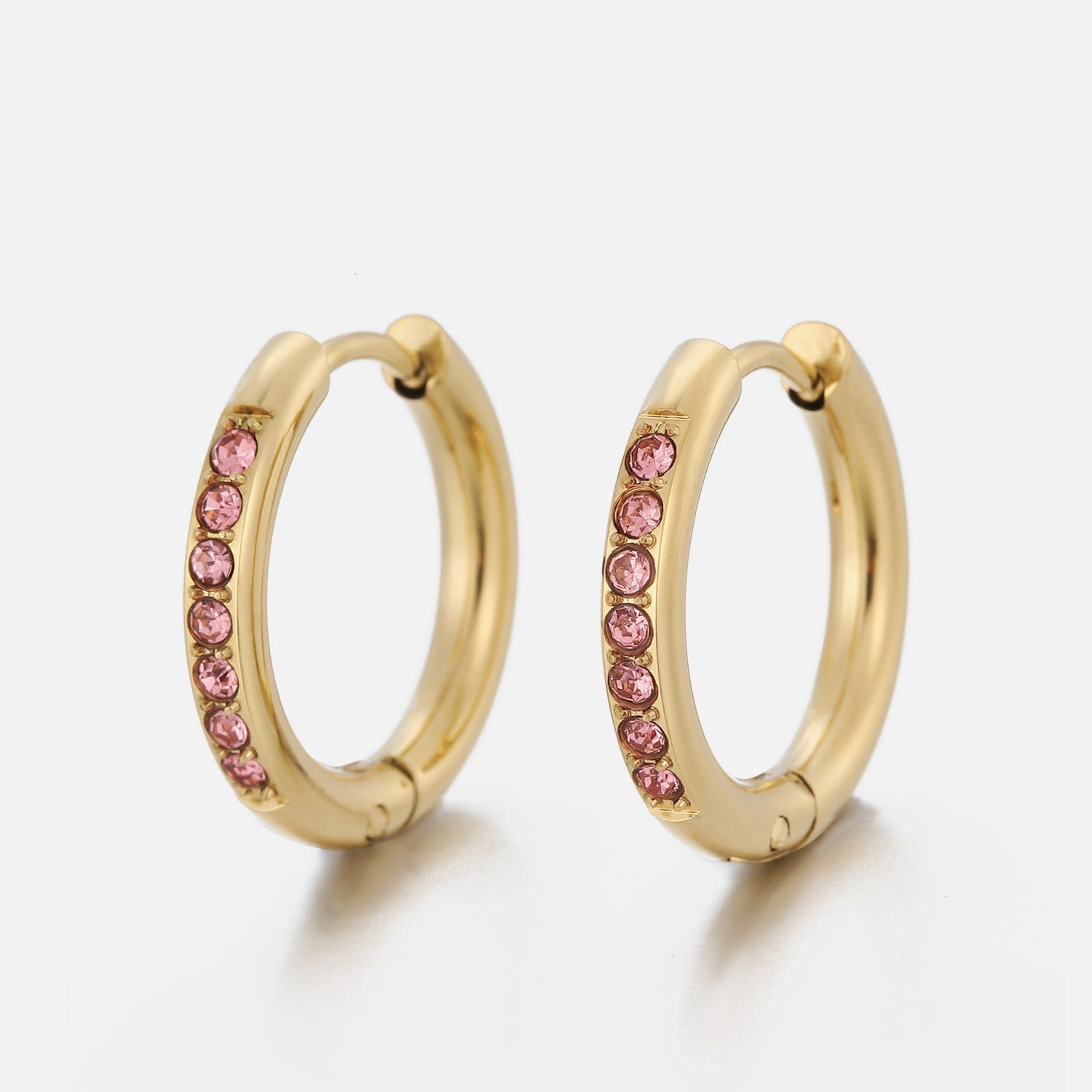 Hoops met steentjes roze/goud - Desieradenconcurrent.nl