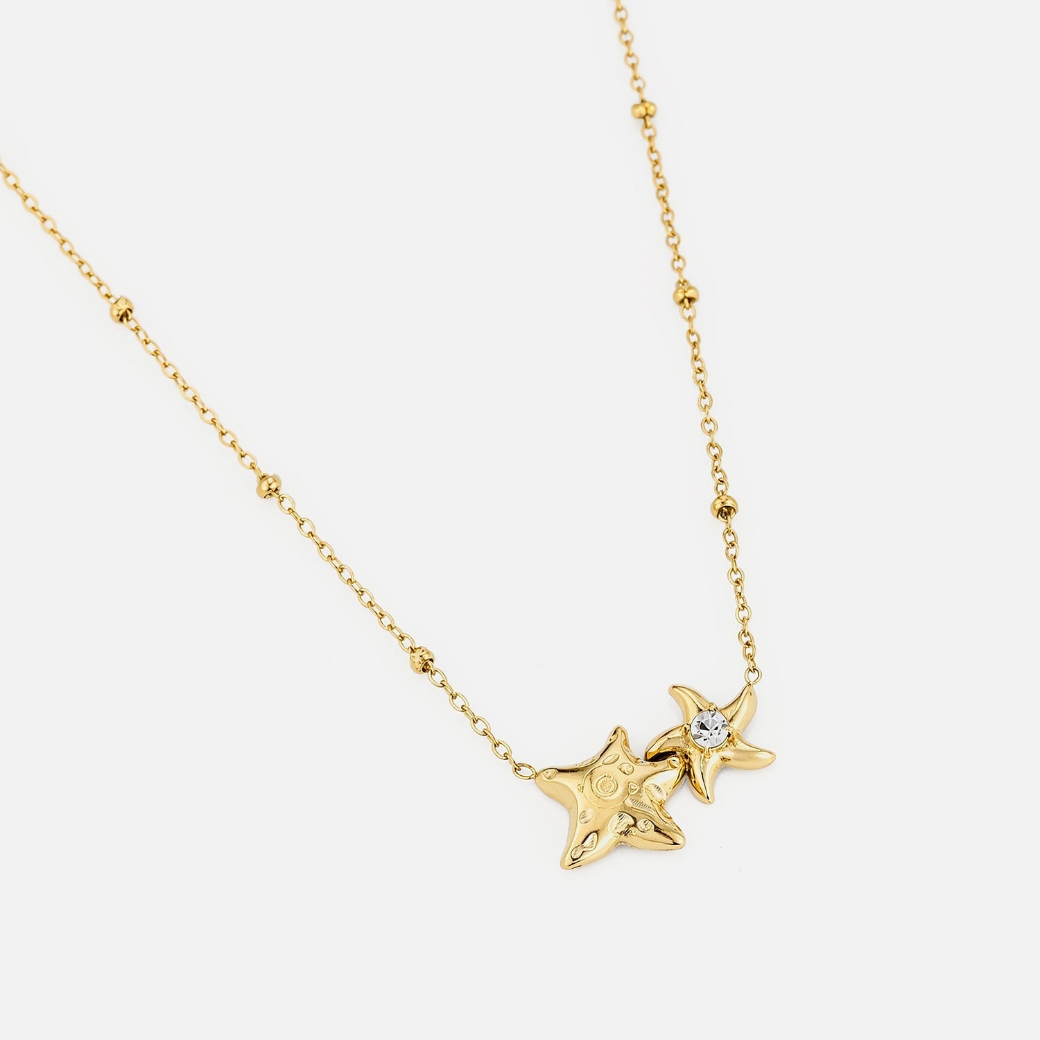Ketting verbonden sterren goud - Desieradenconcurrent.nl