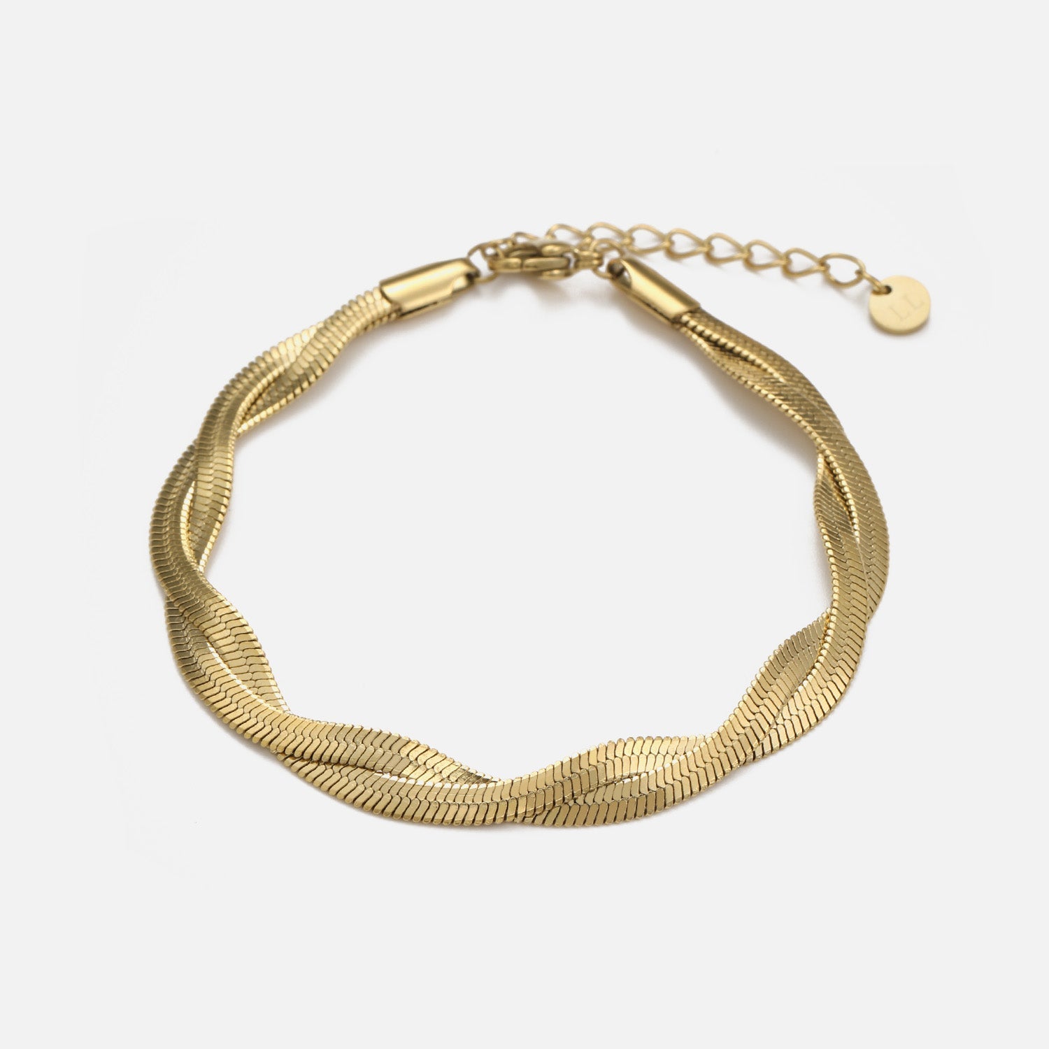 Platte gedraaide armband goud - Desieradenconcurrent.nl