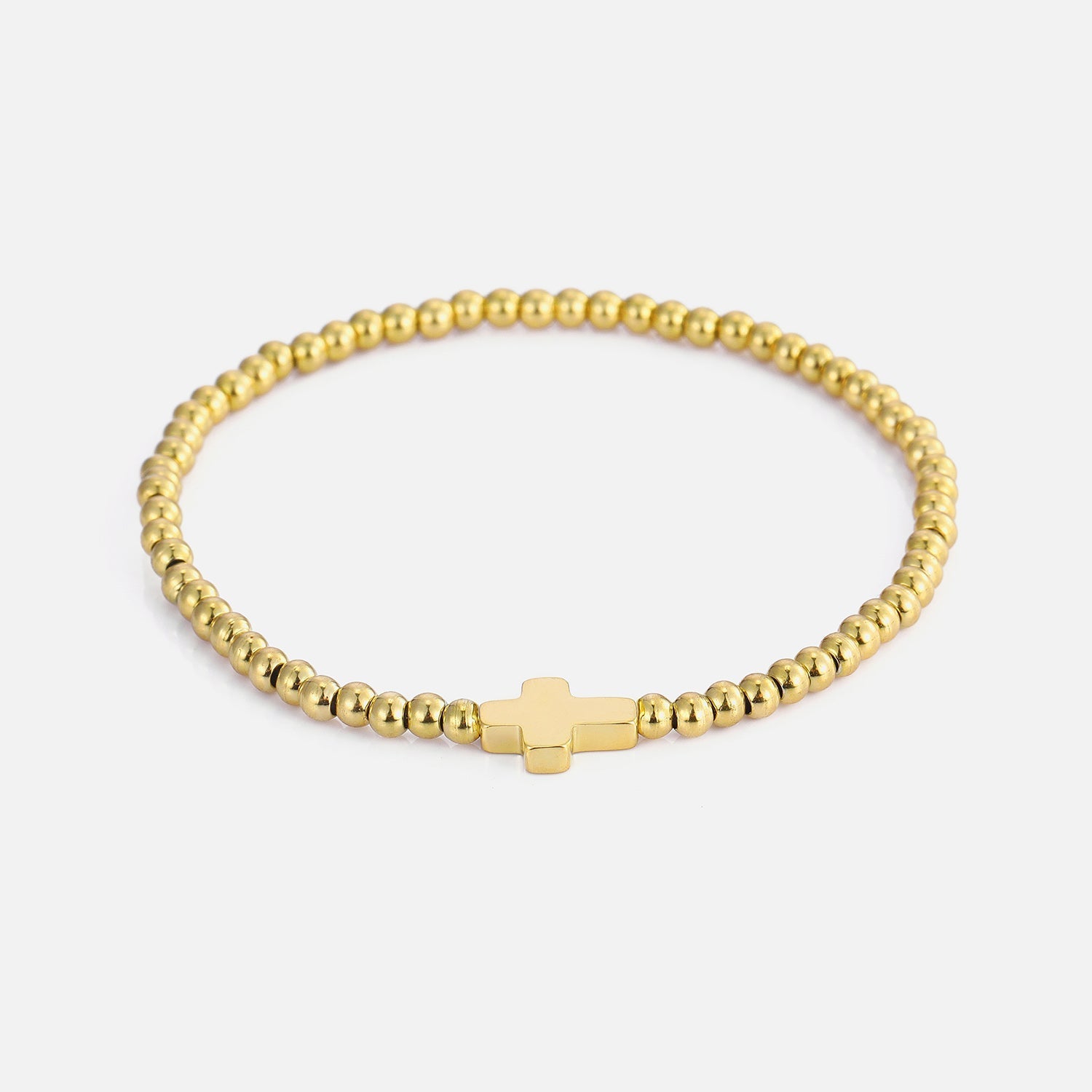 Armband stretch kruisje goud - Desieradenconcurrent.nl