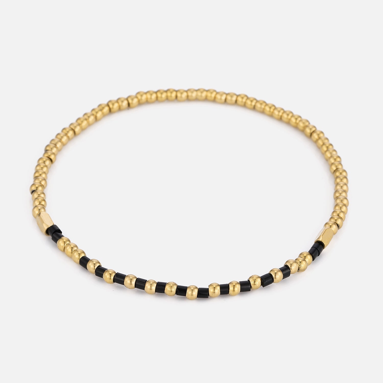 Armband zwarte kralen stretch goud - Desieradenconcurrent.nl