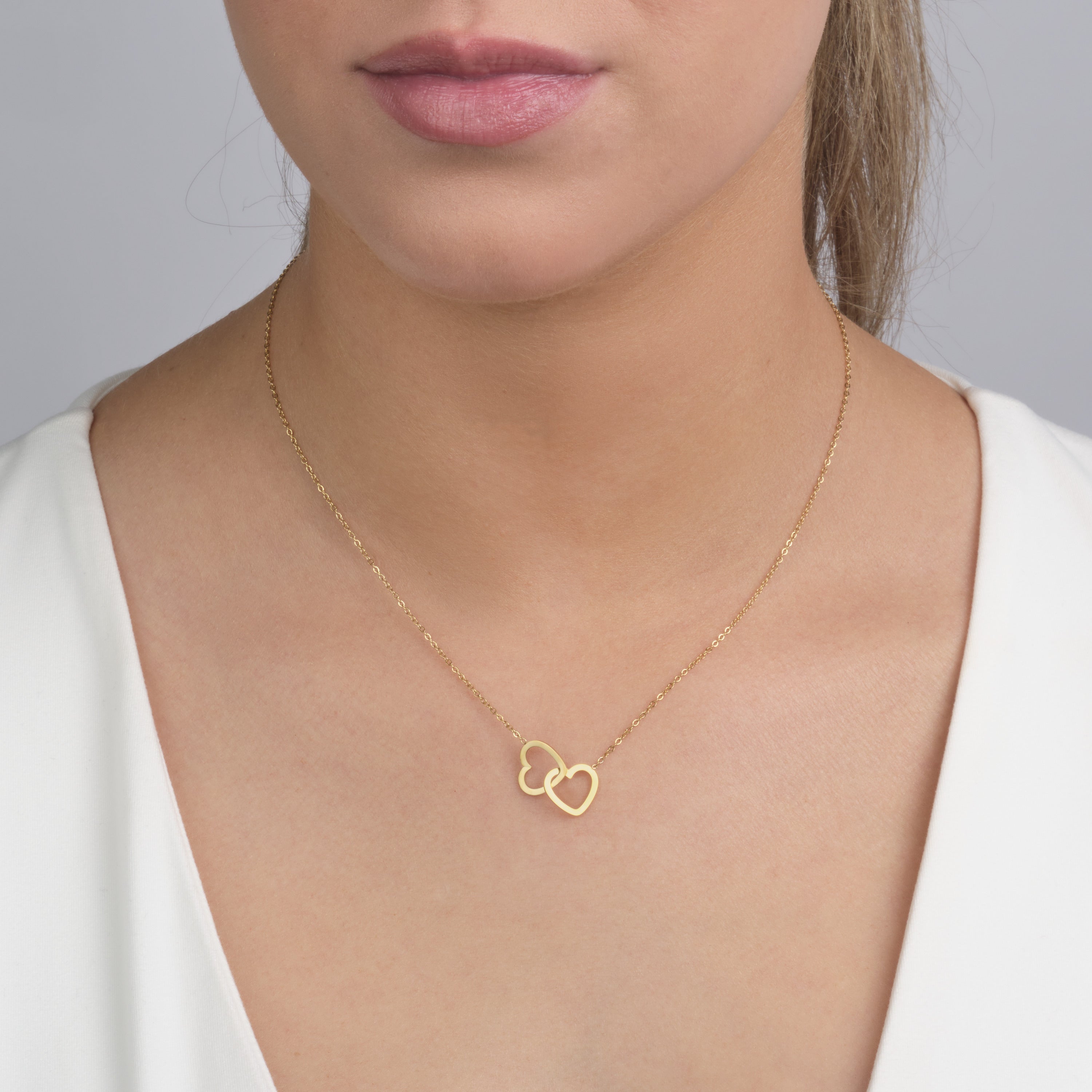 Ketting verbonden hart goud - Desieradenconcurrent.nl
